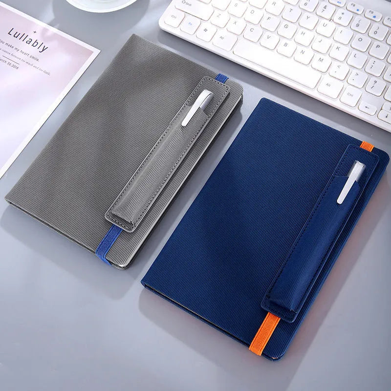 A5 faux leather notebook in blue with strap and pen insert, 200 pages, lying flat