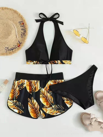 Stylish leaf print bikini with shorts in a variety of vibrant colors, perfect for summer beach or pool wear.