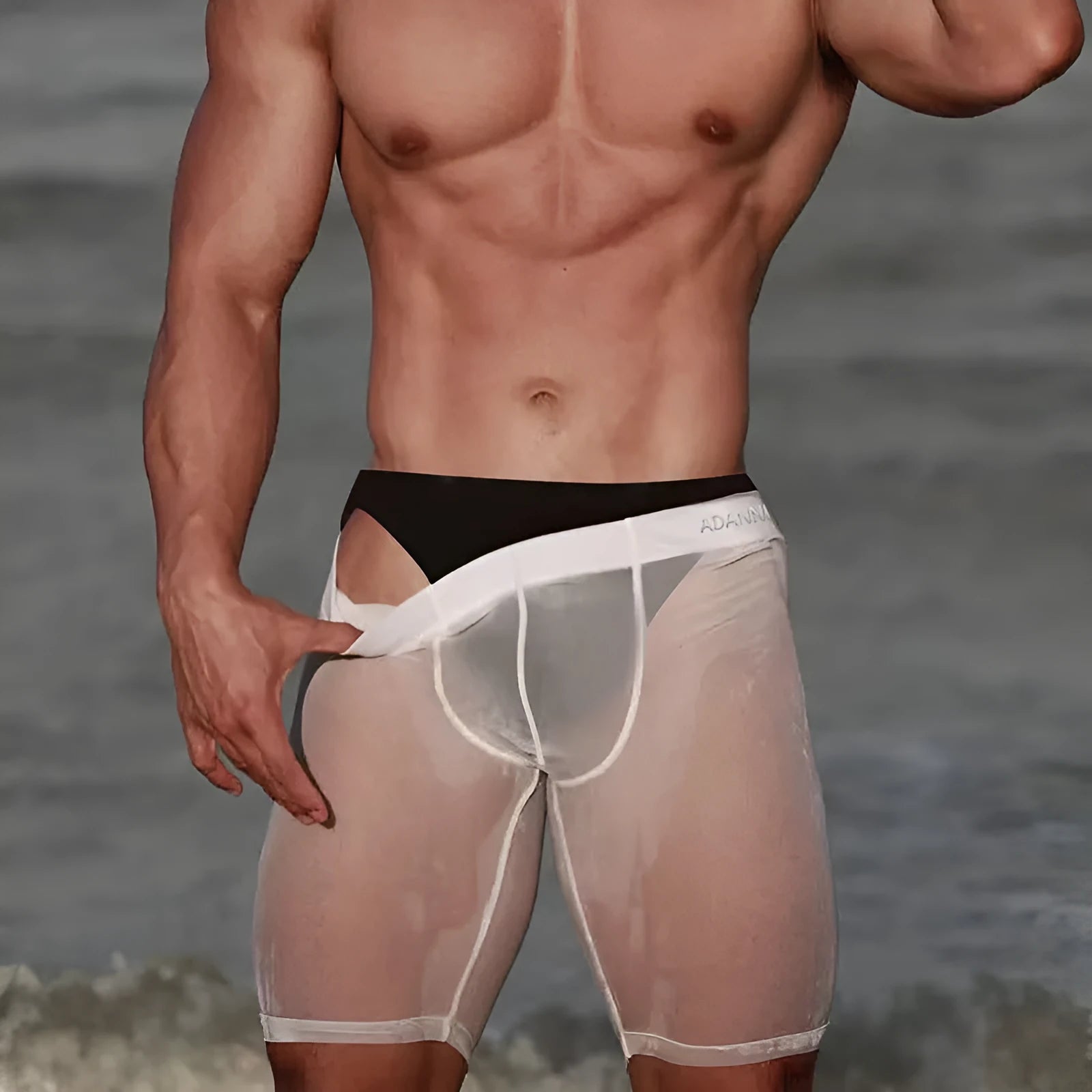 Men's mesh shorts in black colour showing seamless knitted construction and hip support design