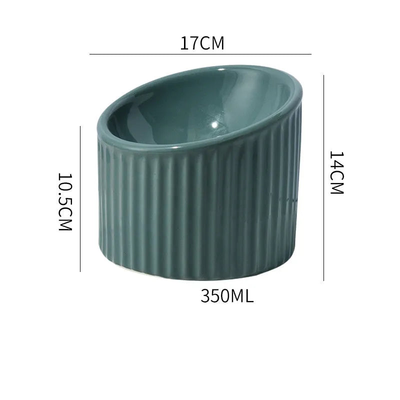 Elevated ceramic cat bowl in green colour with round shape and tilted design for whisker-friendly feeding