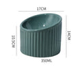Elevated ceramic cat bowl in green colour with round shape and tilted design for whisker-friendly feeding