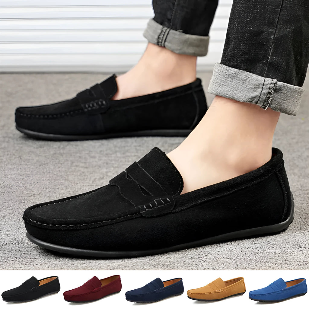 Men's brown suede slip-on loafers with round toe and flat rubber sole on a white background