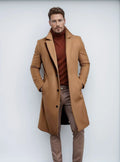 Men's mid-length solid colour woolen coat in dark gray, side view, showing thick fabric and side seam pocket.