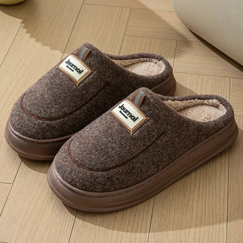 Men's brown thickened cotton slippers with a suede upper and textured sole, shown from the side.