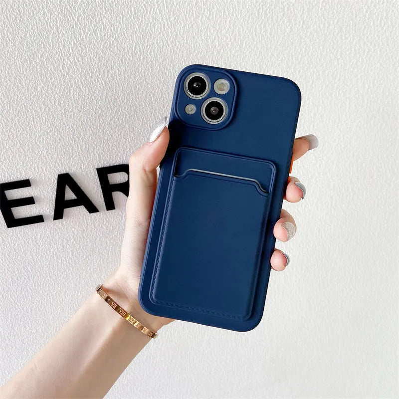 Sky blue silicone iPhone case with a card slot on the back for iPhone 16 and older models.
