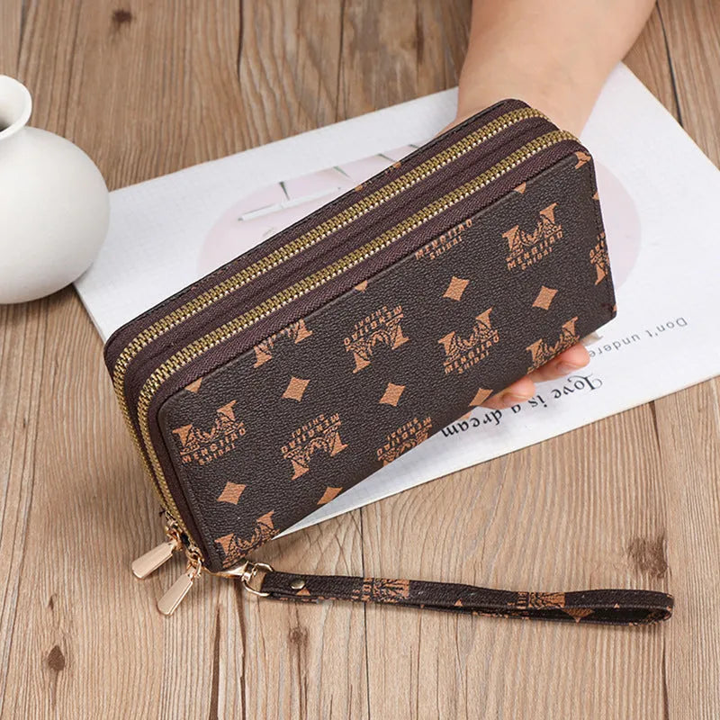 Long PU leather wallet clutch with zip closure and retro print decoration showing internal compartments