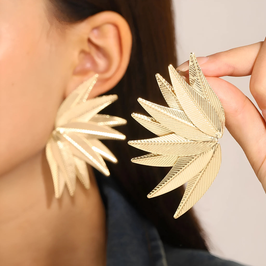 Gold and white leaves patch earrings with detailed leaf design made from alloy metal