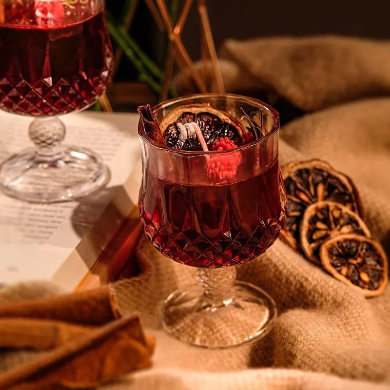 Glass wine goblet shaped aromatherapy candle with French mulled wine fragrance