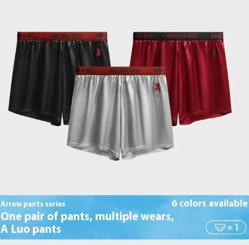 Men's solid colour boxer briefs in black on a mid-waist model.