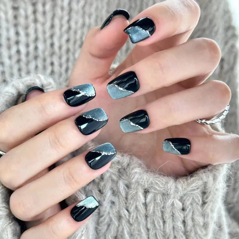 Medium length coffin-shaped fake nails in mixed colours with nail glue and application tools