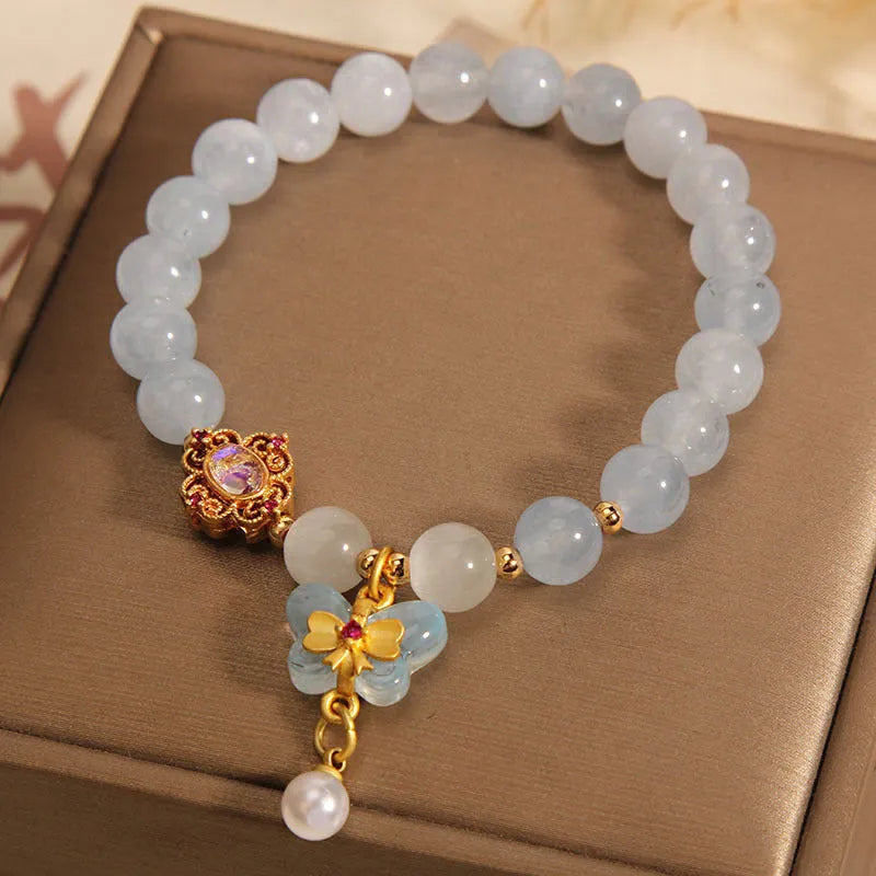 Crystal bracelet with aquamarine butterfly pendant and rhinestone details for women