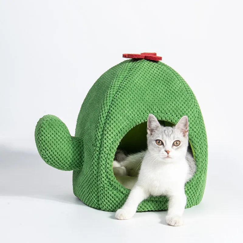 Green enclosed plush cat bed or pet cave for kittens and small dogs.