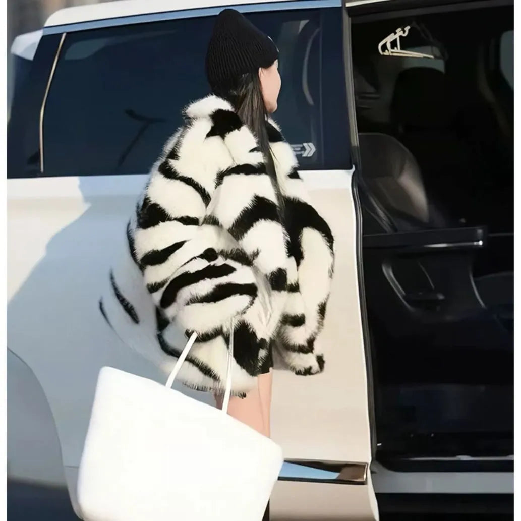 Women's long sleeve zebra stripe top with large skimmer collar and fur effect fabric