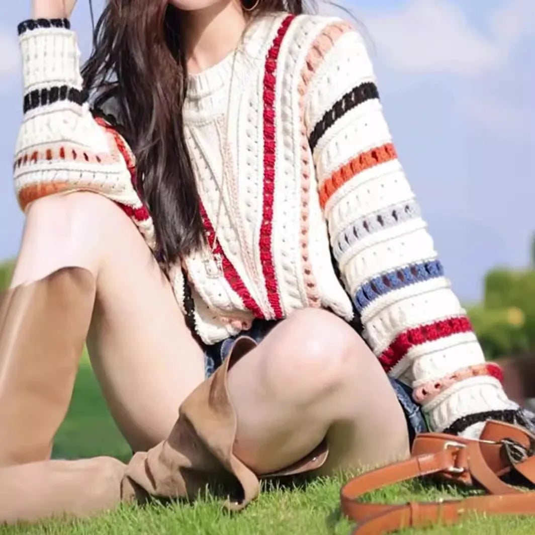 Colourful rainbow striped hollow knit sweater with batwing sleeves and round neck