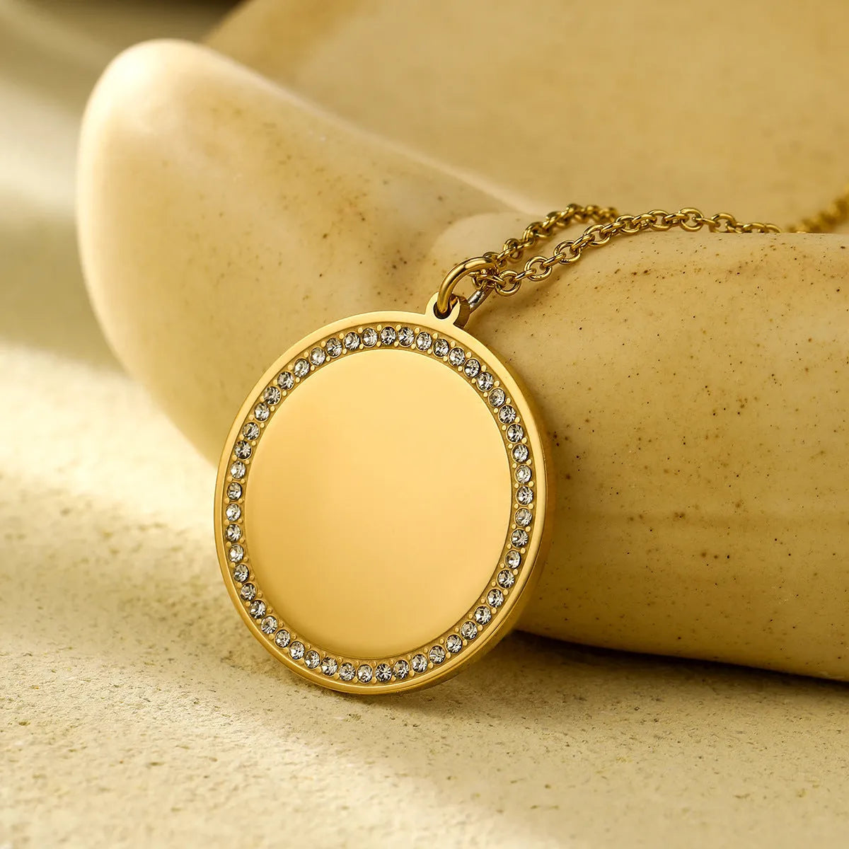 Geometric diamond inlaid titanium steel necklace with 18K gold electroplated finish, adjustable chain 41-50cm, round pendant