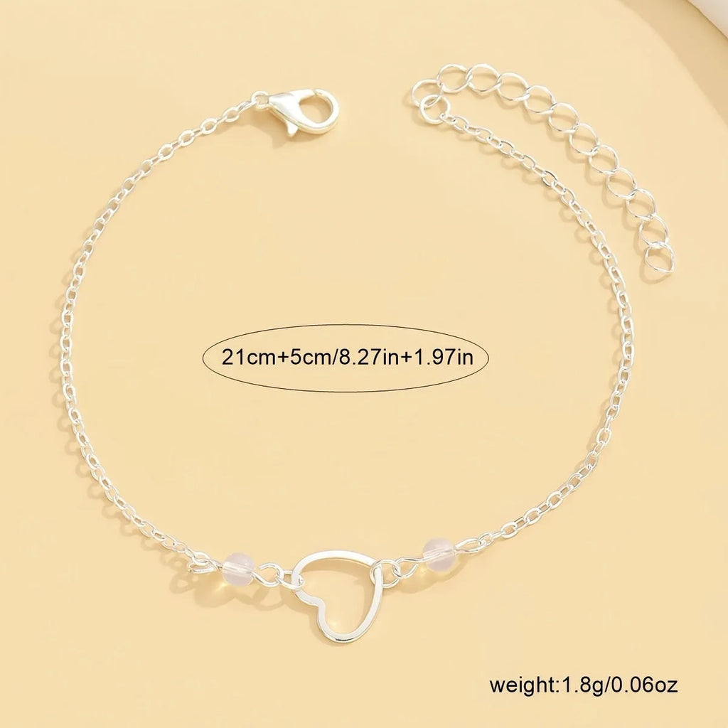 Adjustable gold alloy anklet with heart-shaped pendant on geometric chain