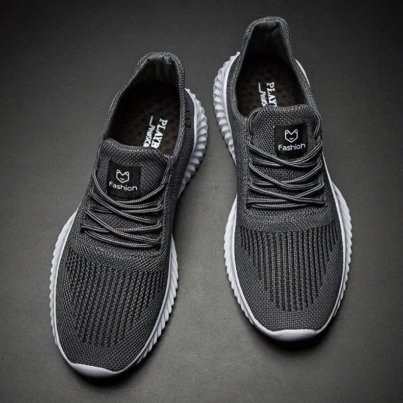 Men's breathable ultra-light running shoes with white upper and grey sole, side view