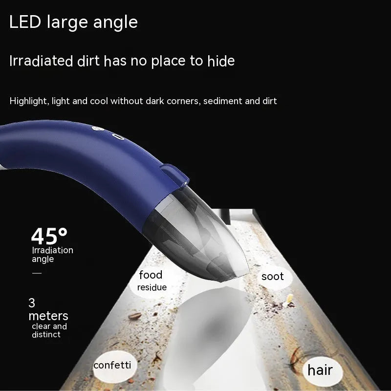 Handheld wireless car vacuum cleaner in black, with USB charging cable.