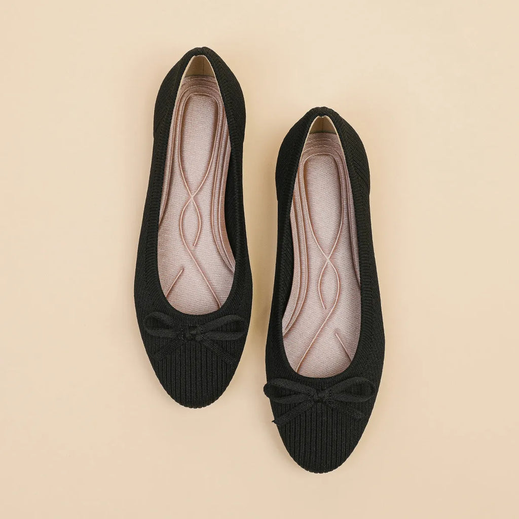 Women's butterfly print flat fabric pumps with round toe and flat heel on a white background.