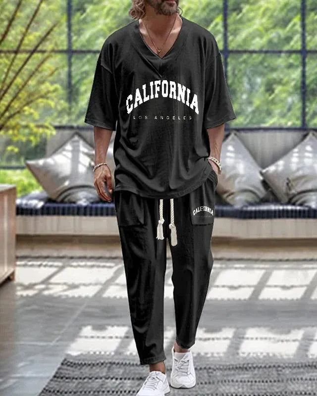 Women's cropped sleeve V-neck trousers suit in thin polyester fabric showing jacket and matching trousers