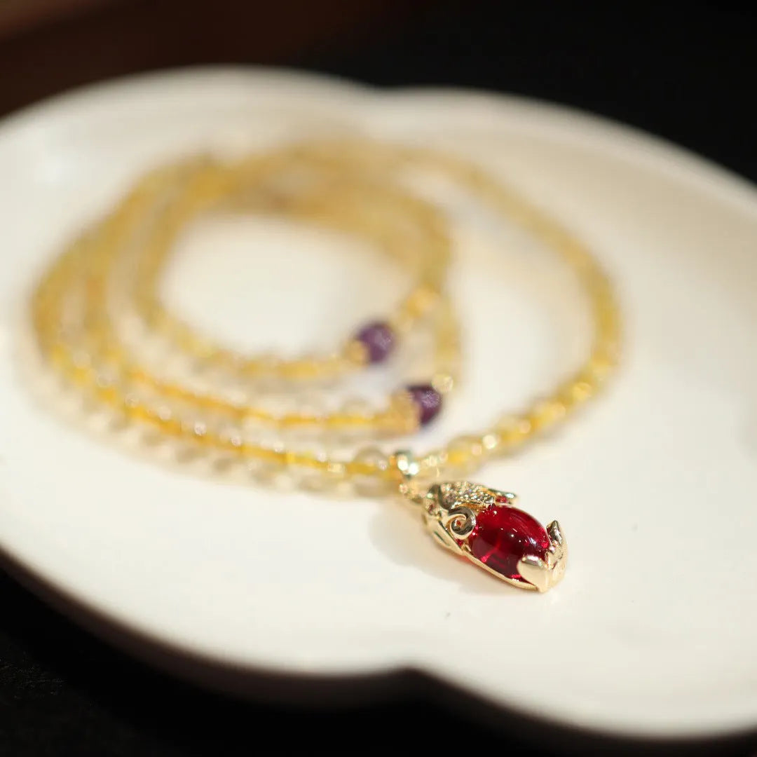 Natural Brazilian rutilated quartz bracelet with Chinese style three gold rings and hanging chopsticks design