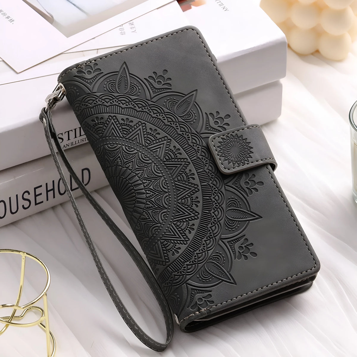 Embossed totem PU leather flip wallet phone case for iPhone with card slots and zipper in black, blue, green, pink, red, or purple.