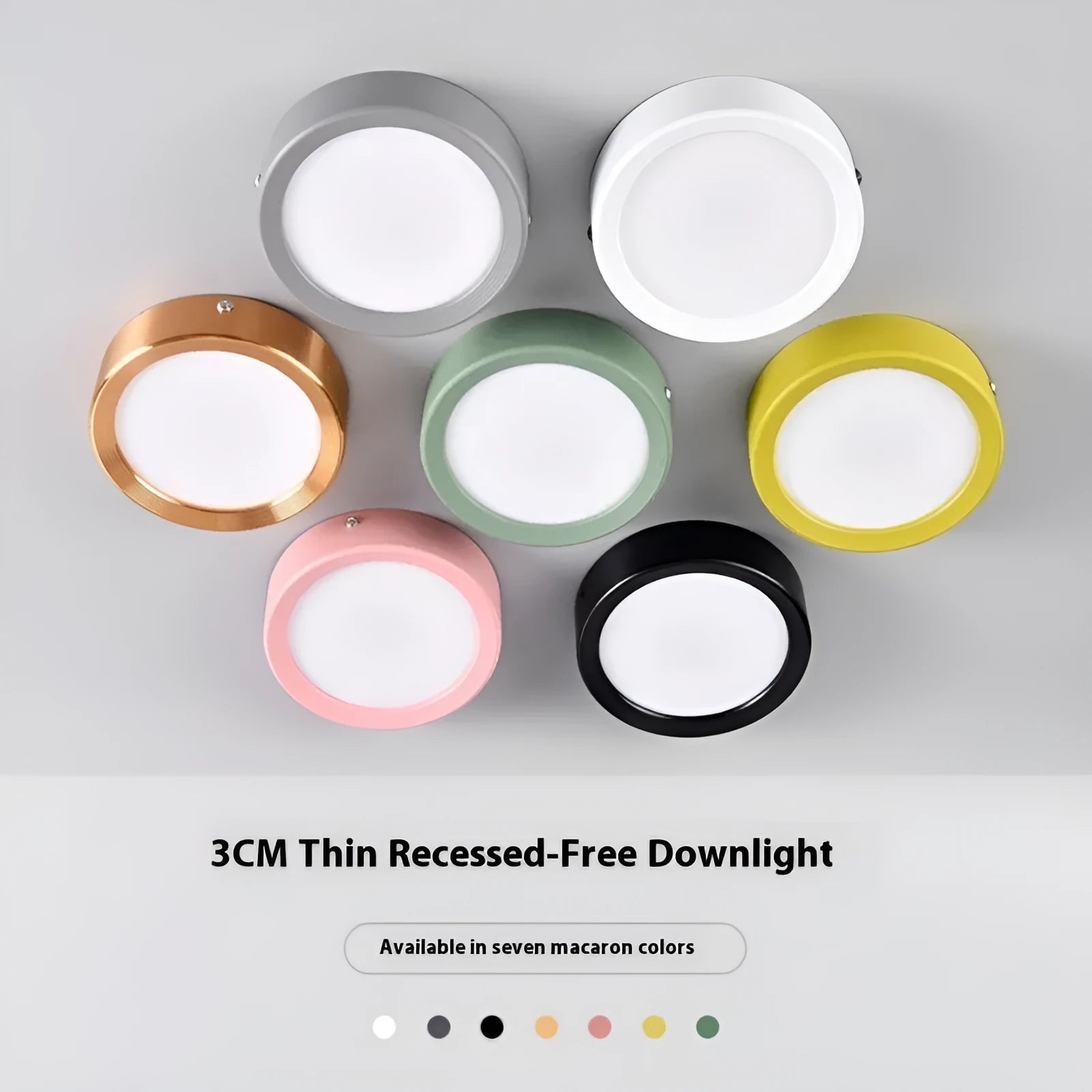 Ultra-thin surface mounted LED downlight in a choice of seven colours including black, white, gold, and pink.