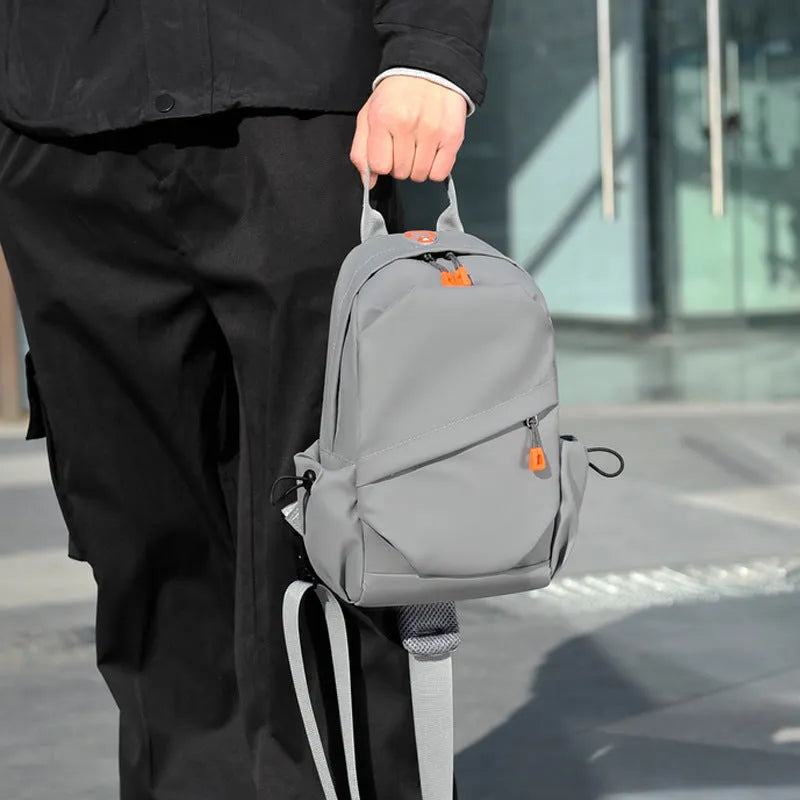Black mens waterproof polyester crossbody bag with adjustable shoulder strap