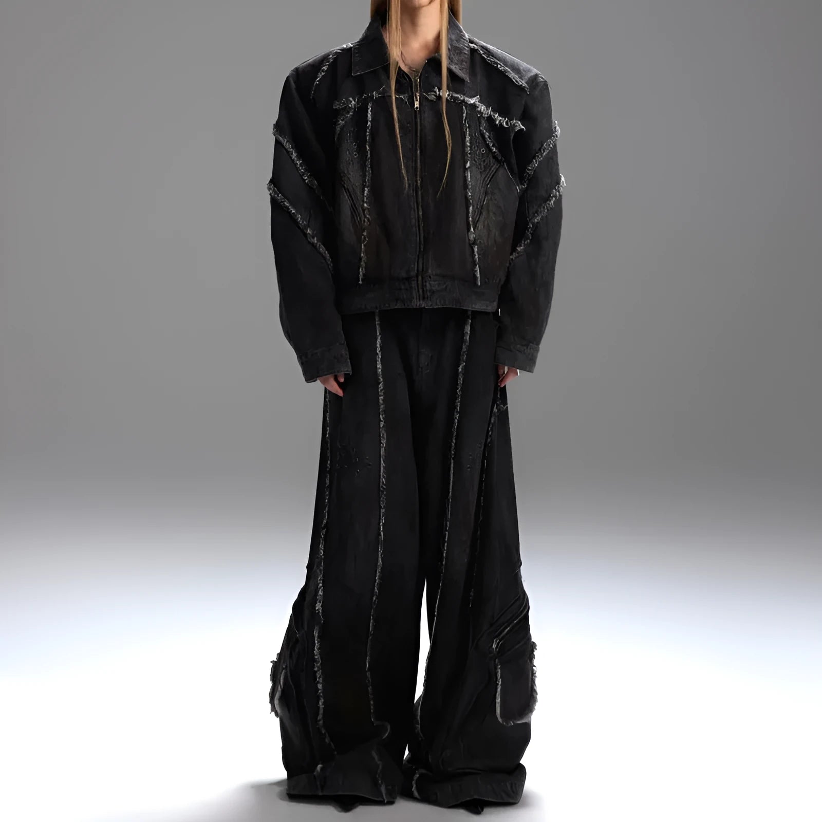 Black loose-fit denim jacket and trouser set with a splash-dye gradient pattern and padded shoulders.