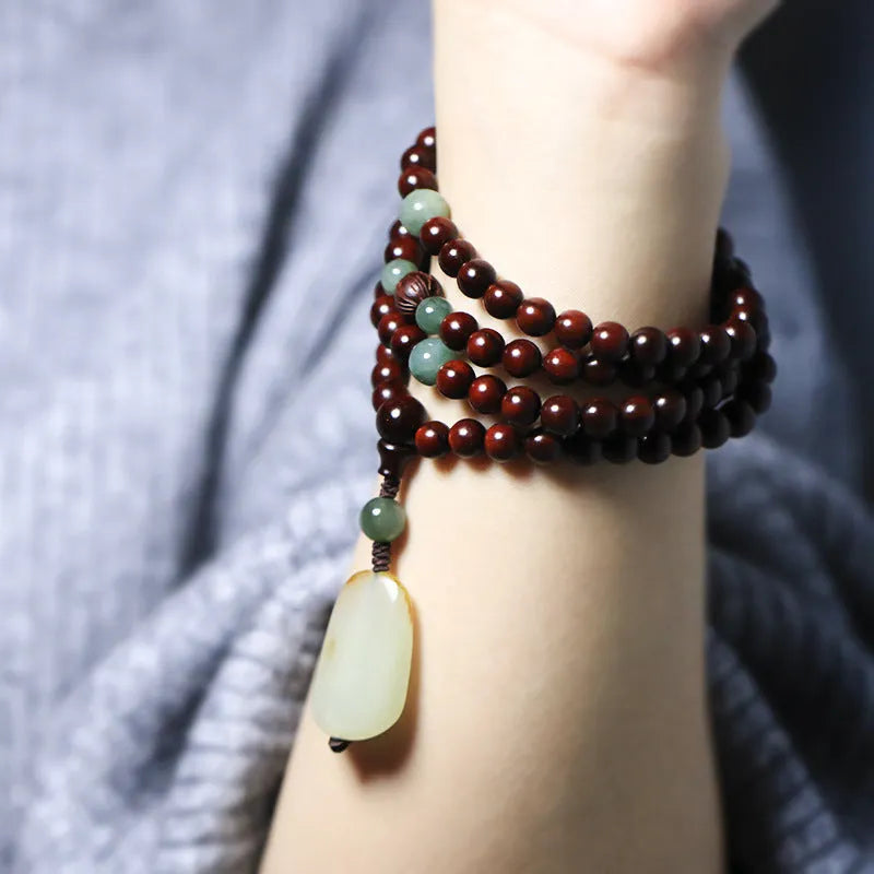 Carved rosewood bead bracelet with a Hotian Jade pendant, showing 6mm and 8mm size options.