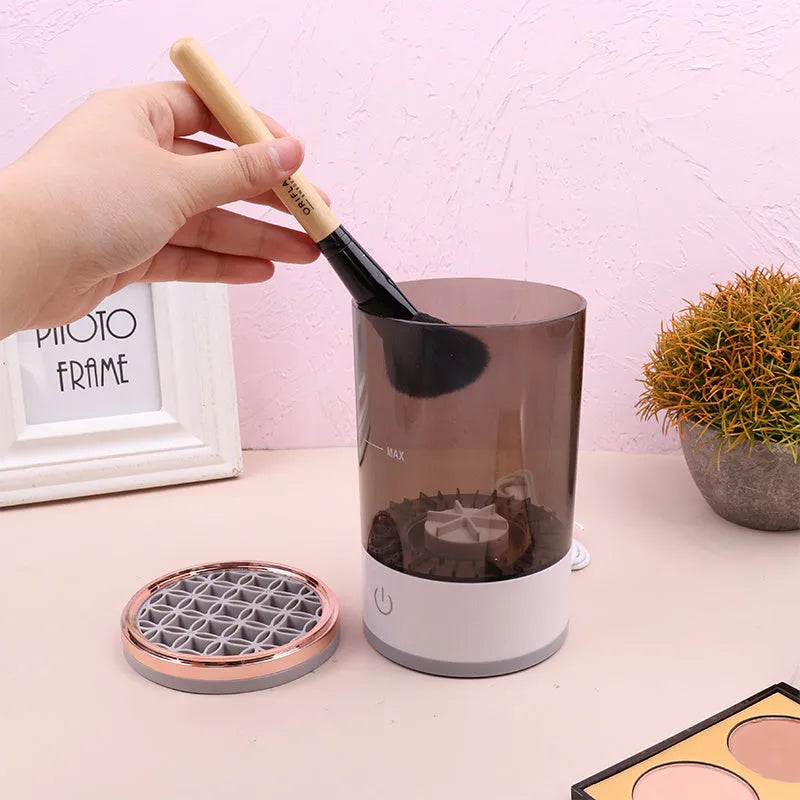 Grey and white portable electric makeup brush cleaner with USB charging cable