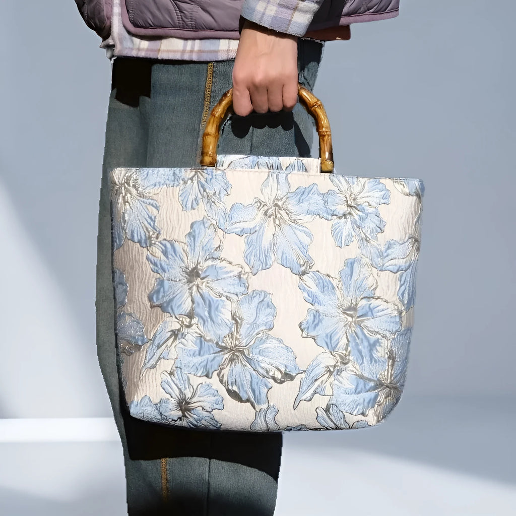 Light blue square canvas shoulder bag with gold bronzing flower pattern and double straps