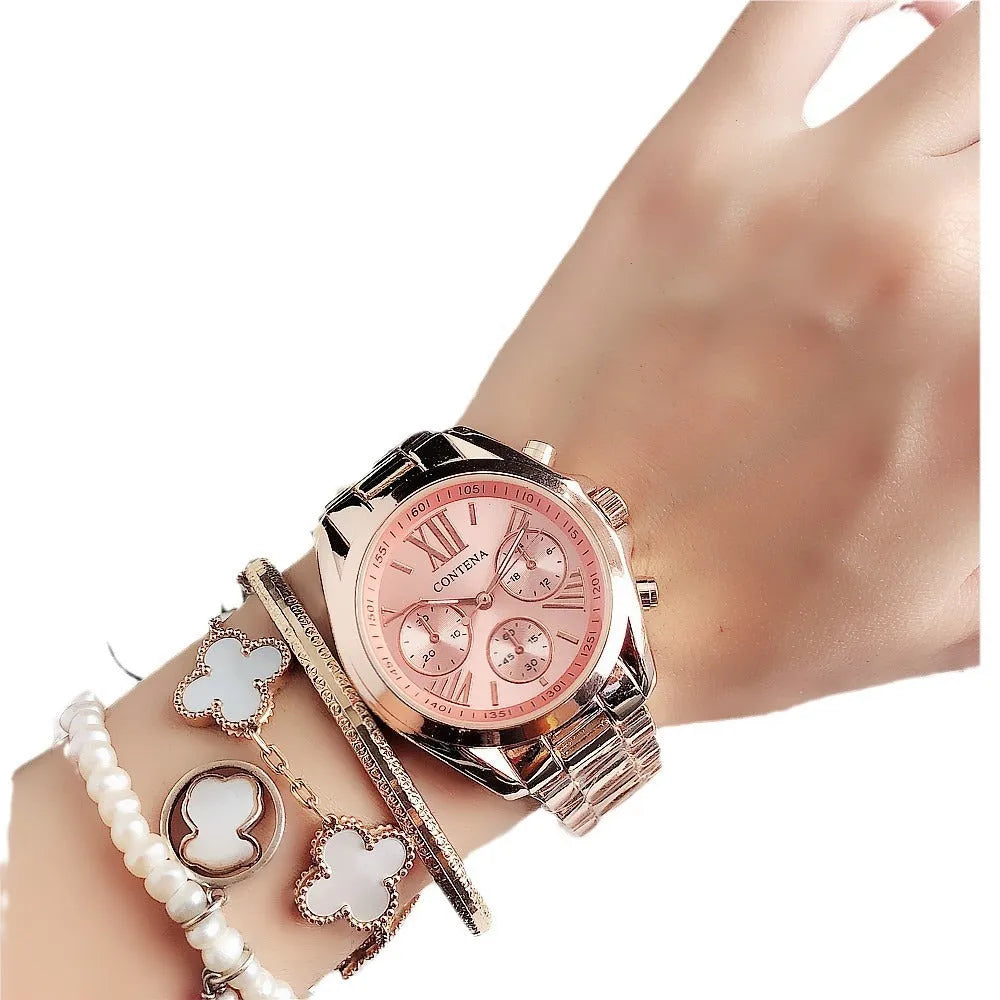 Women's silver rose gold fashion watch with mesh strap and pointer display.