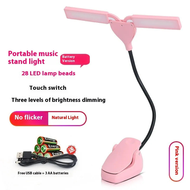 Black rechargeable music stand light with 28 LED lamps and USB cable on a metal music stand