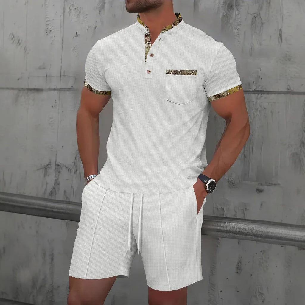 Men's grey waffle weave polo collar short sleeve suit with matching shorts laid flat.