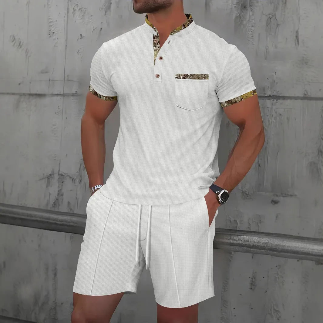 Men's grey waffle weave polo collar short sleeve suit with matching shorts laid flat.