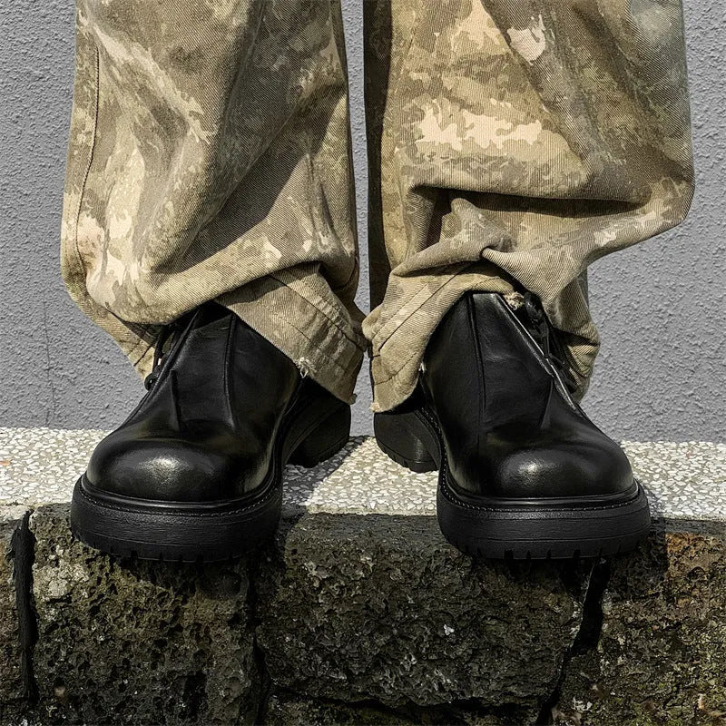 Black leather platform shoes with warped head design and rubber sole