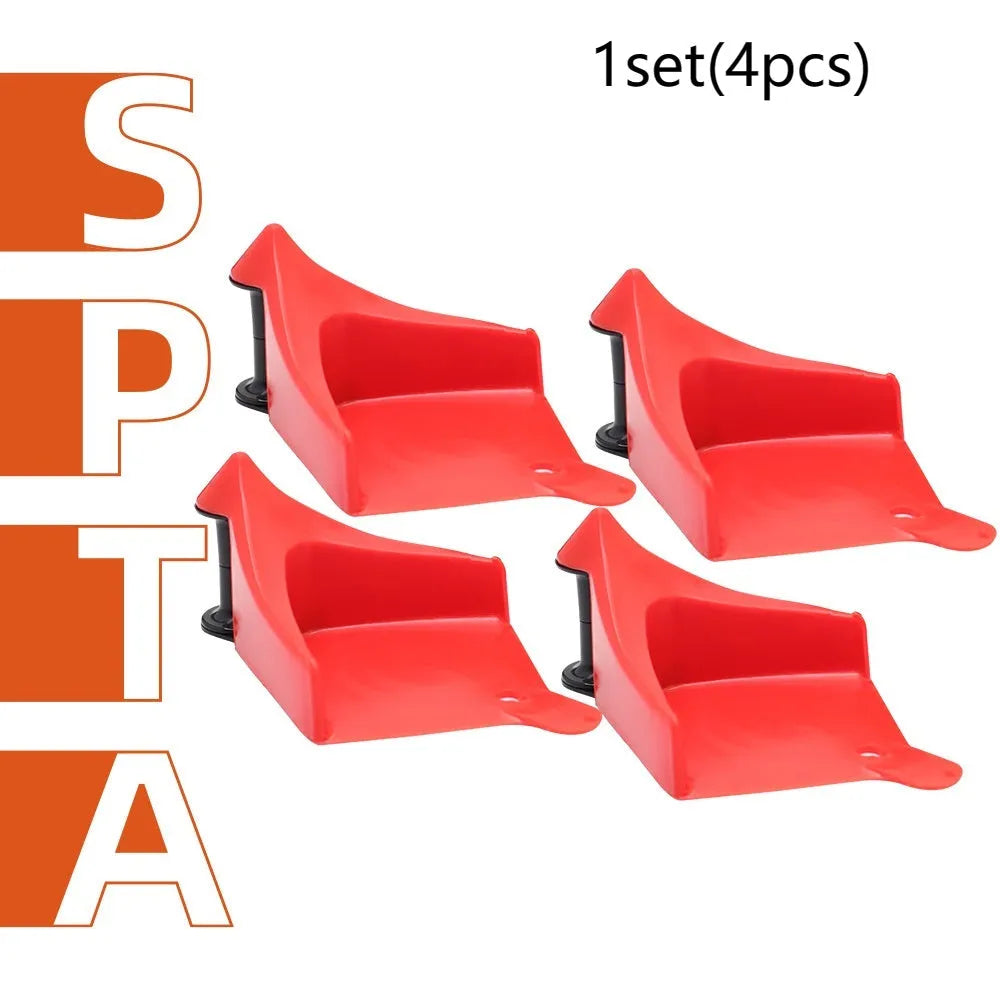 Four red plastic car stop parking blocks with non-slip rubber tread surfaces for tyre guidance
