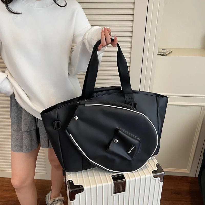 Black one-shoulder yoga storage bag with large 36-55 litre capacity and a single strap.