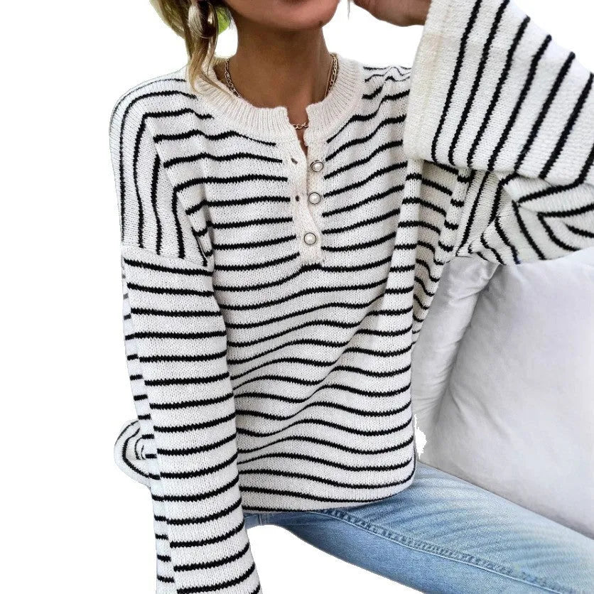 Black striped women's casual top with drop shoulders and button detailing