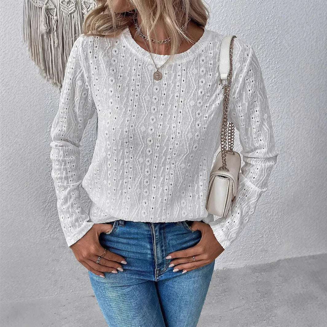 White hollow knit polyester T-shirt with round neck and long sleeves on hanger
