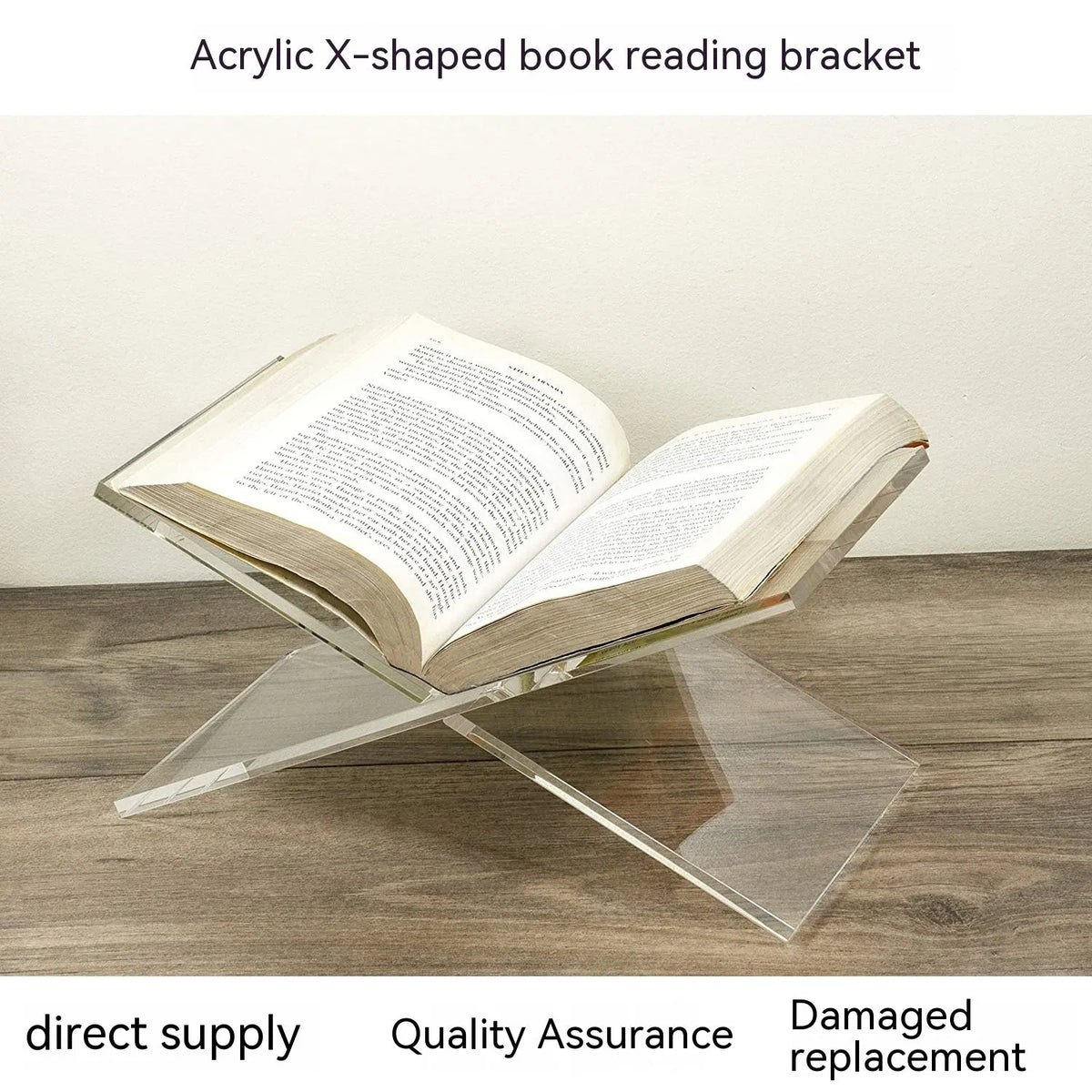 Clear acrylic X-shaped book reading rack displaying a book on a desktop.