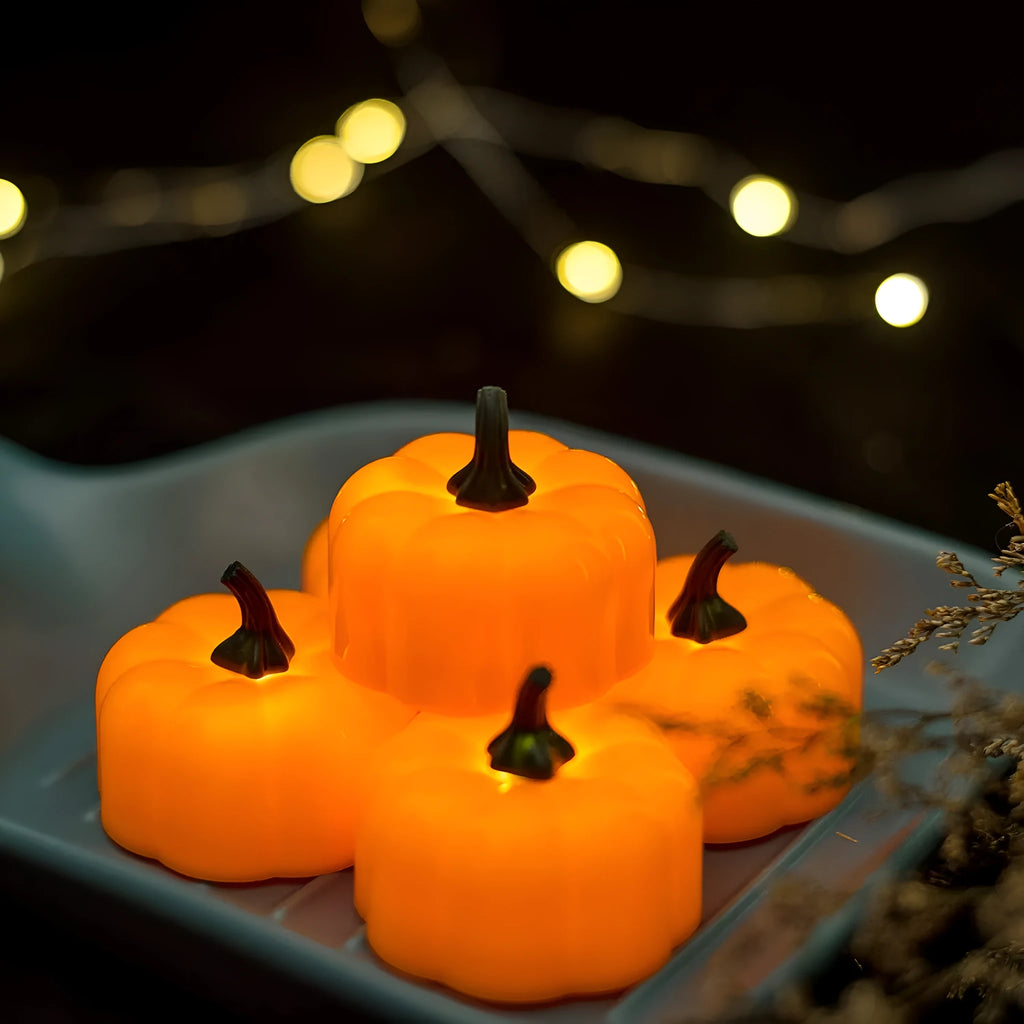 Yellow LED pumpkin light decoration 4.9x4.3 cm on a tabletop for Halloween Christmas party