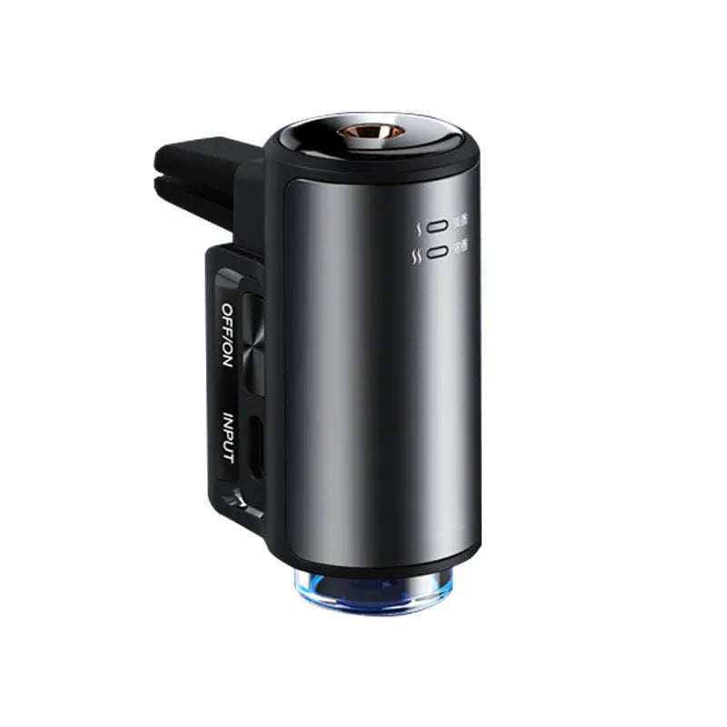 Obsidian black smart car aroma diffuser clipped onto a car air vent