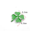 Green silver edge large zinc alloy four-leaf clover car body sticker on a car panel