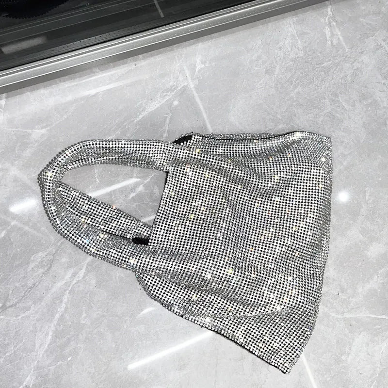 Silver handbag with shiny rhinestone decoration and open pocket design