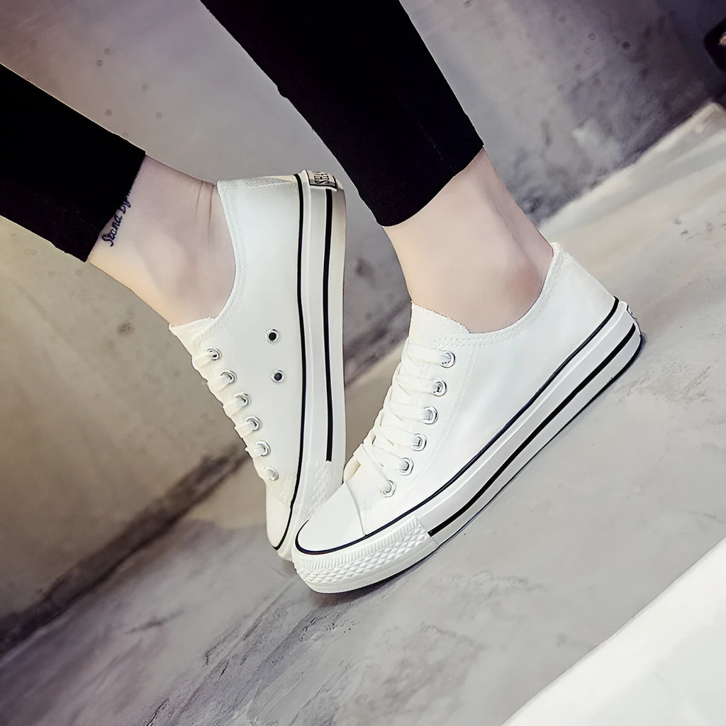Women's casual canvas shoes in solid colours showing black, white black, white red and all black options