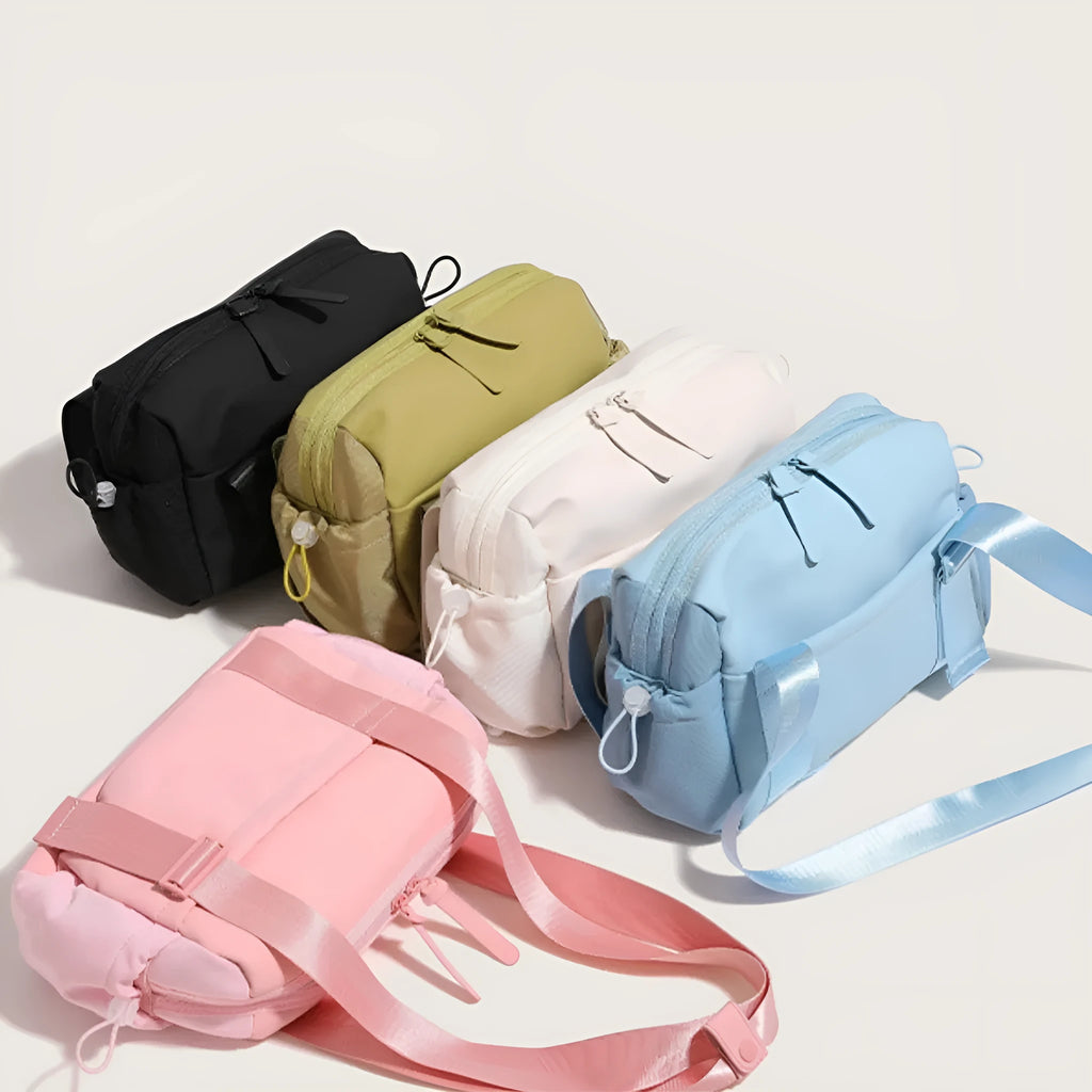 Large capacity nylon travel buggy bag in pink, blue, black, green or creamy white with double shoulder straps and zip compartments