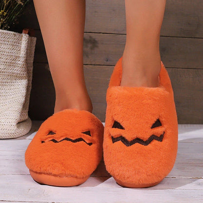 Cozy pumpkin-themed slippers with plush coral velvet upper and non-slip PVC sole for comfortable indoor wear