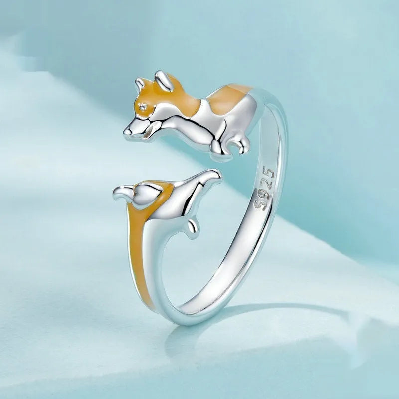 Silver electroplated cartoon corgi fashion ring for women on a white background.